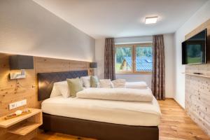 Postel nebo postele na pokoji v ubytování HUS23 with Wellness