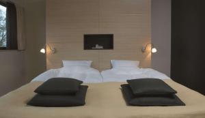 Een bed of bedden in een kamer bij Radisson Blu Hotel i Papirfabrikken, Silkeborg