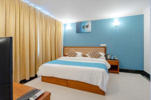 Postel nebo postele na pokoji v ubytování Noomoo Hulhumale