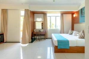 Postel nebo postele na pokoji v ubytování Noomoo Hulhumale