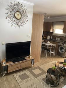 a living room with a large flat screen tv at Comfortable & quiet apartment 1 in Alexandroupoli