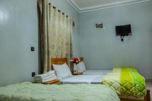Tempat tidur dalam kamar di Hotel Palace Zaida