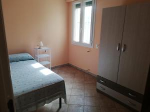 Ένα ή περισσότερα κρεβάτια σε δωμάτιο στο CASA VACANZE MACCHIE