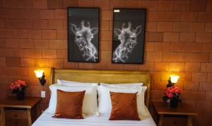 Cama ou camas em um quarto em Vila Pugliesi Hotel Boutique