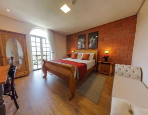 Cama ou camas em um quarto em Vila Pugliesi Hotel Boutique
