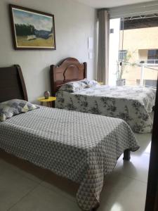 Кровать или кровати в номере Apartamento Fruto da Terra 301 VISTA PANORÂMICA MONTANHAS
