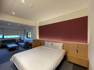 Voodi või voodid majutusasutuse Fu Kuang Hotel toas