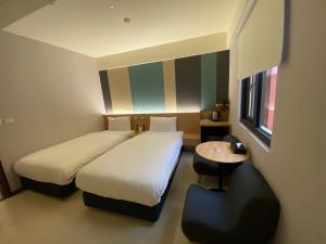 Voodi või voodid majutusasutuse Fu Kuang Hotel toas