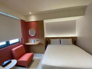 Voodi või voodid majutusasutuse Fu Kuang Hotel toas