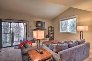 a living room with a couch and a table at Deck and Spa Access Modern Breckenridge Condo! in Breckenridge