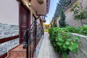 a walkway leading to a door of a house at Complex Koko Hills in Sapareva Banya