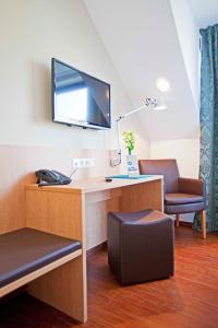 TV a/nebo společenská místnost v ubytování Sebcity Hotel