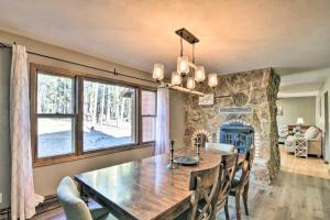 a dining room with a table and a large window at Charming Leadville Retreat with Private Hot Tub in Leadville