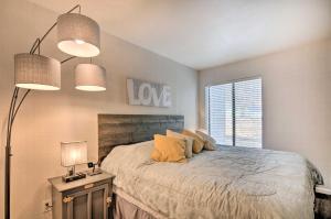 a bedroom with a bed and two lamps and a window at Sweet Skiers Escape Less Than Half-Mile to the Slopes! in Brian Head
