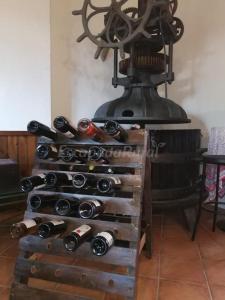 a bunch of wine bottles in a wine rack at CASA BACO in Casas Ibáñez