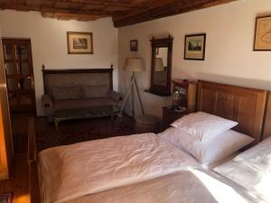 Postel nebo postele na pokoji v ubytování Apartmány pod věží