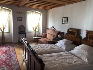 Postel nebo postele na pokoji v ubytování Apartmány pod věží