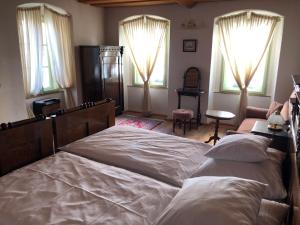 Postel nebo postele na pokoji v ubytování Apartmány pod věží