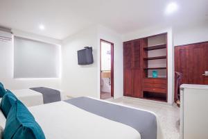 Ayenda Hotel Carivdi客房内的一张或多张床位
