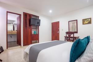 Ayenda Hotel Carivdi客房内的一张或多张床位