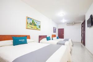 Ayenda Hotel Carivdi客房内的一张或多张床位