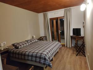 Postel nebo postele na pokoji v ubytování Albergo Diffuso Borgo Retrosi di Amatrice