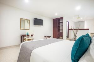 Ayenda Hotel Carivdi客房内的一张或多张床位