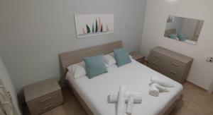 A bed or beds in a room at Stella Marina Holiday Home
