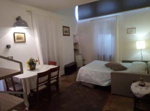 Una cama o camas en una habitación de Appartamenti Arena