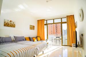 Postel nebo postele na pokoji v ubytování Palmeras Suite Fuengirola + 30 fotografií