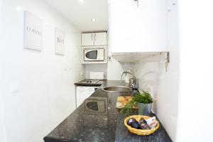 Kuchyň nebo kuchyňský kout v ubytování Palmeras Suite Fuengirola