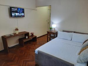 Säng eller sängar i ett rum på Piazza Mendoza