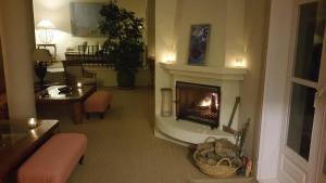 a living room with a fireplace in a living room at miKasa Agua Amarga & SPA in Agua Amarga