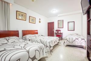 Ayenda Hotel Carivdi客房内的一张或多张床位