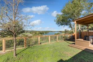 a backyard with a gazebo and a view of a river at Guadalupe Bluff Farmhouse in Kerrville