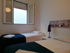 Кровать или кровати в номере Alojamiento Temporal el Puente