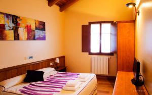 Postel nebo postele na pokoji v ubytování Hostal Musunzar