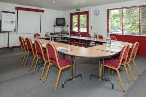 a conference room with a large table and chairs at Campanile Hotel - Basildon - East of London in Basildon