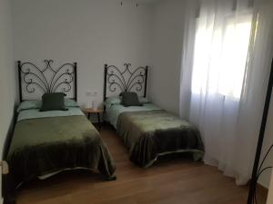 Postel nebo postele na pokoji v ubytování Rancho Blanco Tarifa La peña