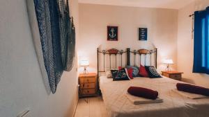 Posteľ alebo postele v izbe v ubytovaní Sunny Time La Mata + 37 fotografií