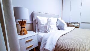 Posteľ alebo postele v izbe v ubytovaní NA WYDMIE APARTAMENT - Rezydencja Niechorze 111
