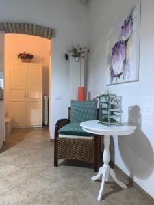 a living room with a table and a chair at Casa Michelina in Vasto