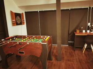 a room with a pool table in the middle of it at The Balcony pool villa in Ban Khanong Phra Nua