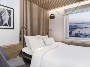 Postel nebo postele na pokoji v ubytování Radisson Blu Hotel Tromsø