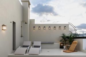 A balcony or terrace at La Colonial Suites Apartamentos de Lujo