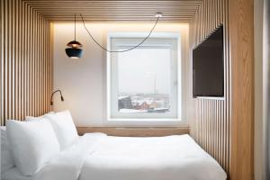 Postel nebo postele na pokoji v ubytování Radisson Blu Hotel Tromsø