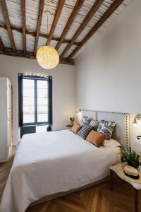 Postel nebo postele na pokoji v ubytování La Colonial Suites Apartamentos de Lujo