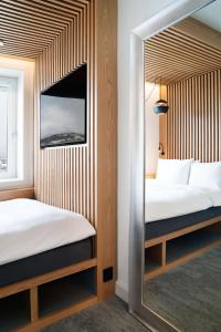 Postel nebo postele na pokoji v ubytování Radisson Blu Hotel Tromsø