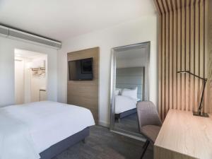 Postel nebo postele na pokoji v ubytování Radisson Blu Hotel Tromsø