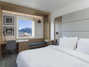 Postel nebo postele na pokoji v ubytování Radisson Blu Hotel Tromsø